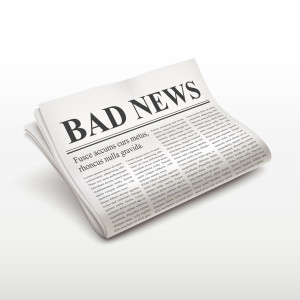 bad news words on newspaper over white background